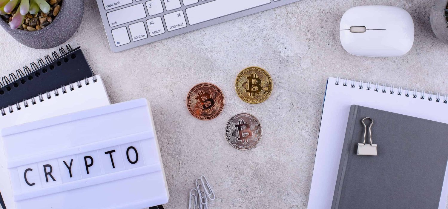 bitcoin-coins-on-office-desk-cryptocurrency-conce-2023-11-27-04-52-19-utc-min (1)